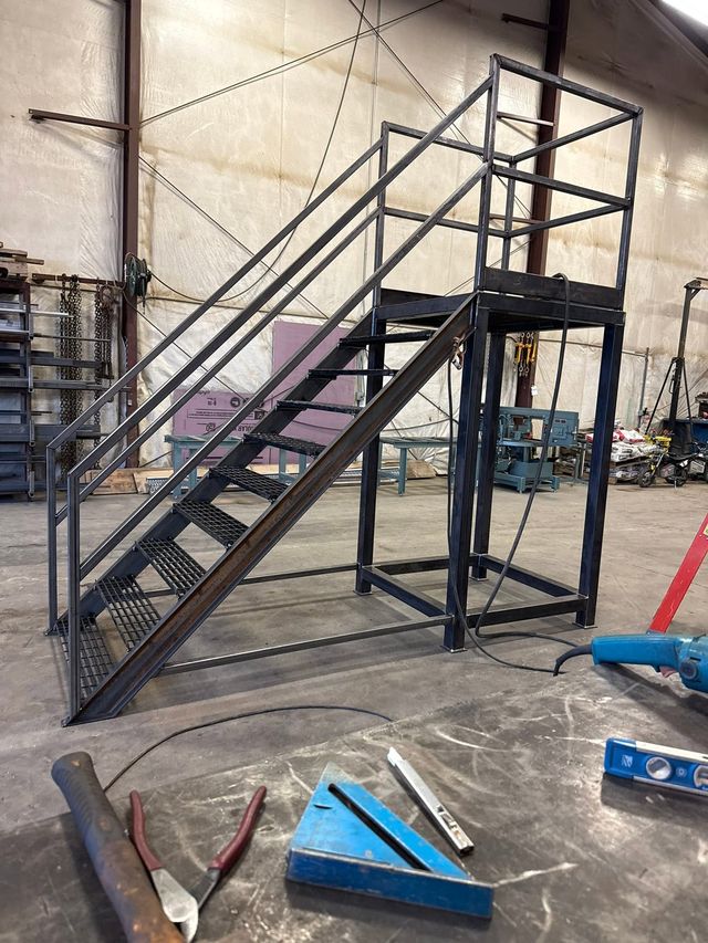 Black steel stair tower being built on the HWF shop floor